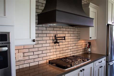 faucet above gas stove